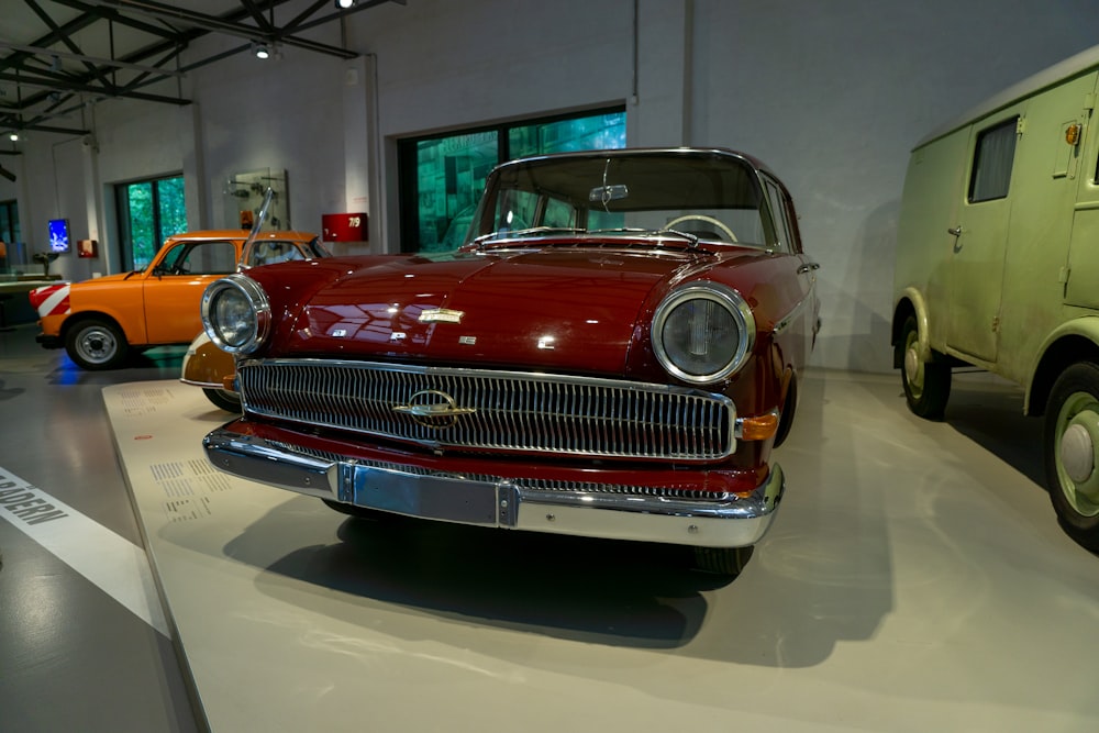 an old car is on display in a museum