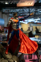 360-degree video still of a dynamic superhero model printed in layered gray tones.