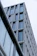 A modern architectural design showcasing a sleek residential building with large windows.