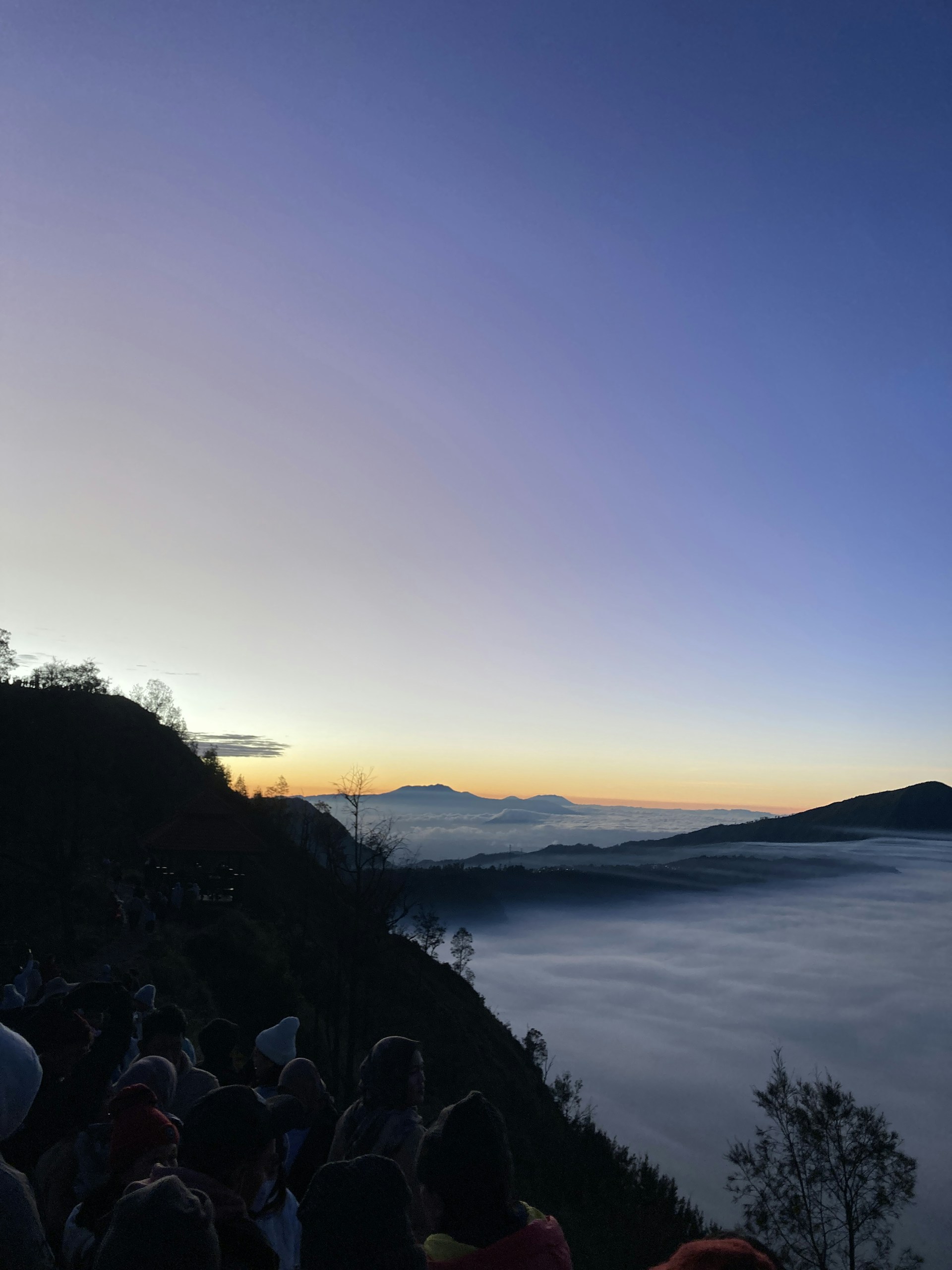 woman wearing yellow long-sleeved dress under white clouds and blue sky during daytime