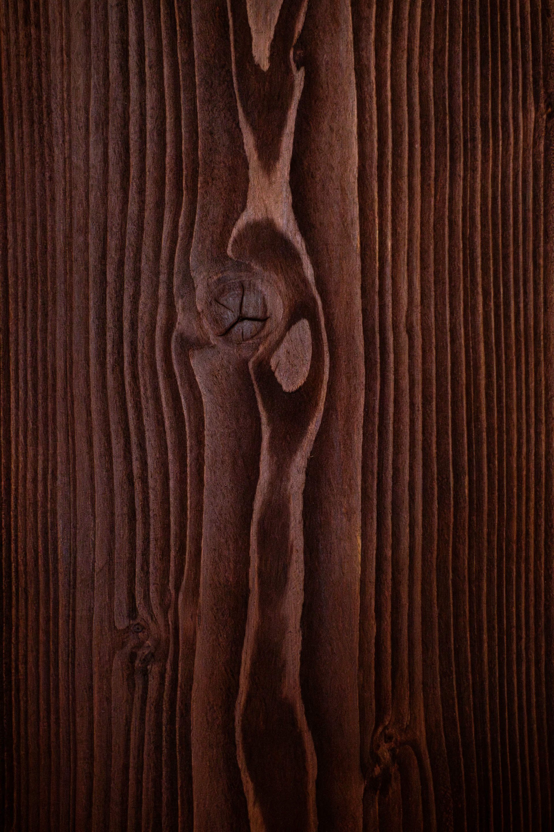 a close up of a piece of wood with a knot on it