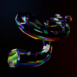 A still from a black and red animated music video featuring abstract shapes.