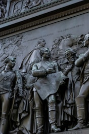 a close up of a statue of a group of people