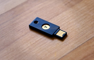a wooden usb stick sitting on top of a wooden table