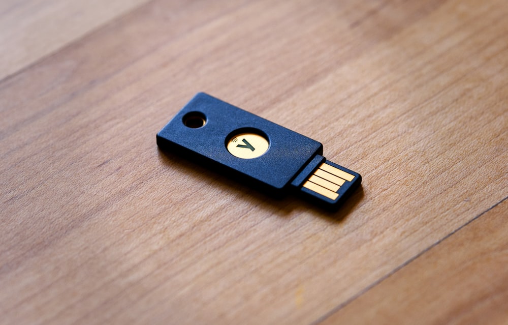 a wooden usb stick sitting on top of a wooden table