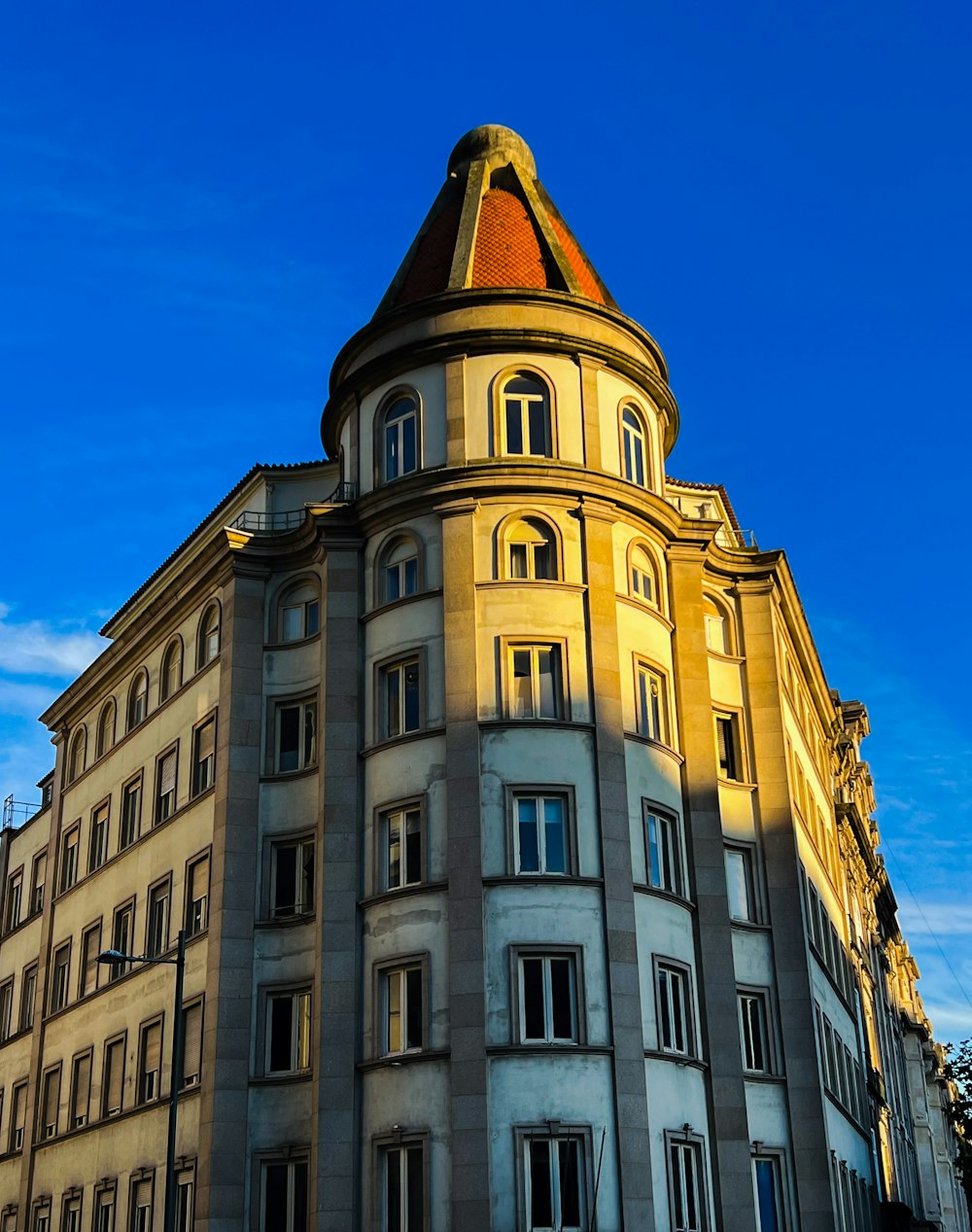 a tall building with a clock on the top of it