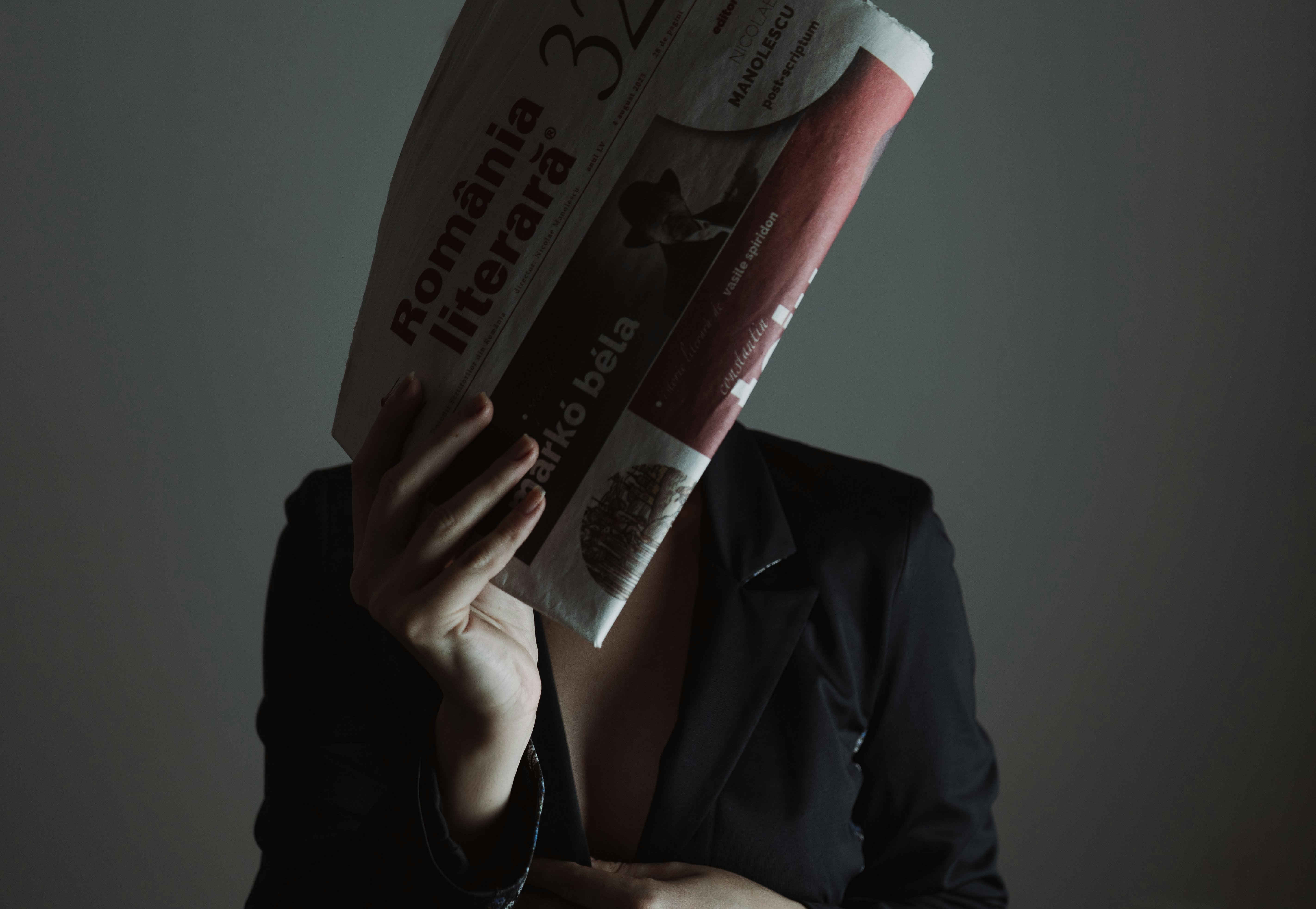 Woman holding newspaper