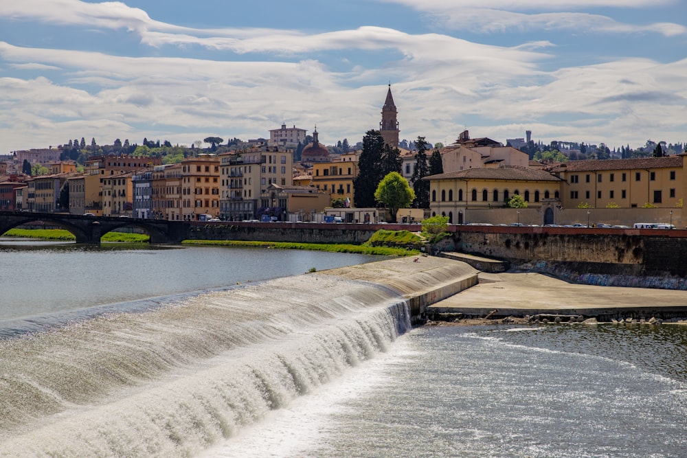 a river running through a city next to a bridge