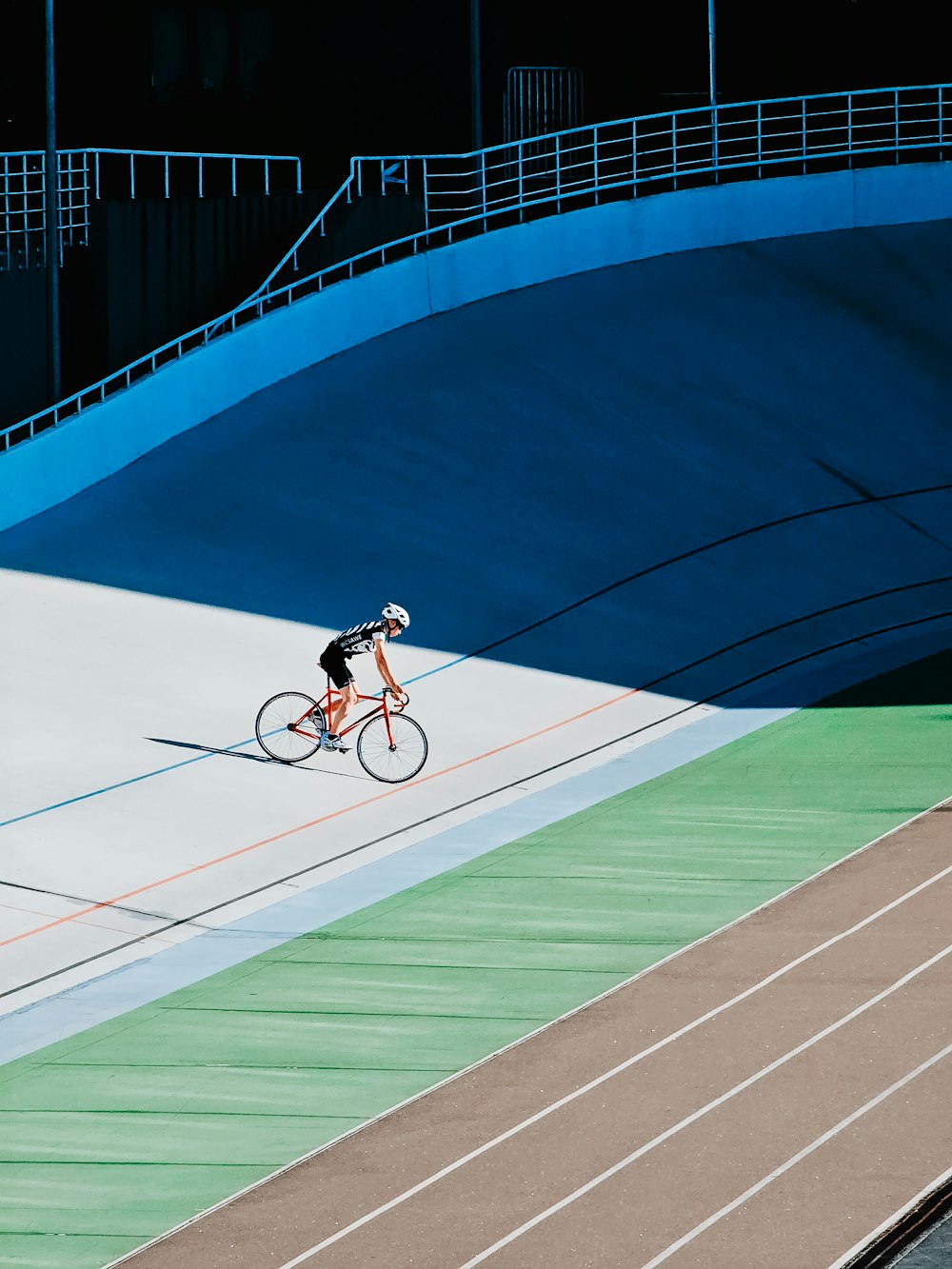 a person riding a bike on a track