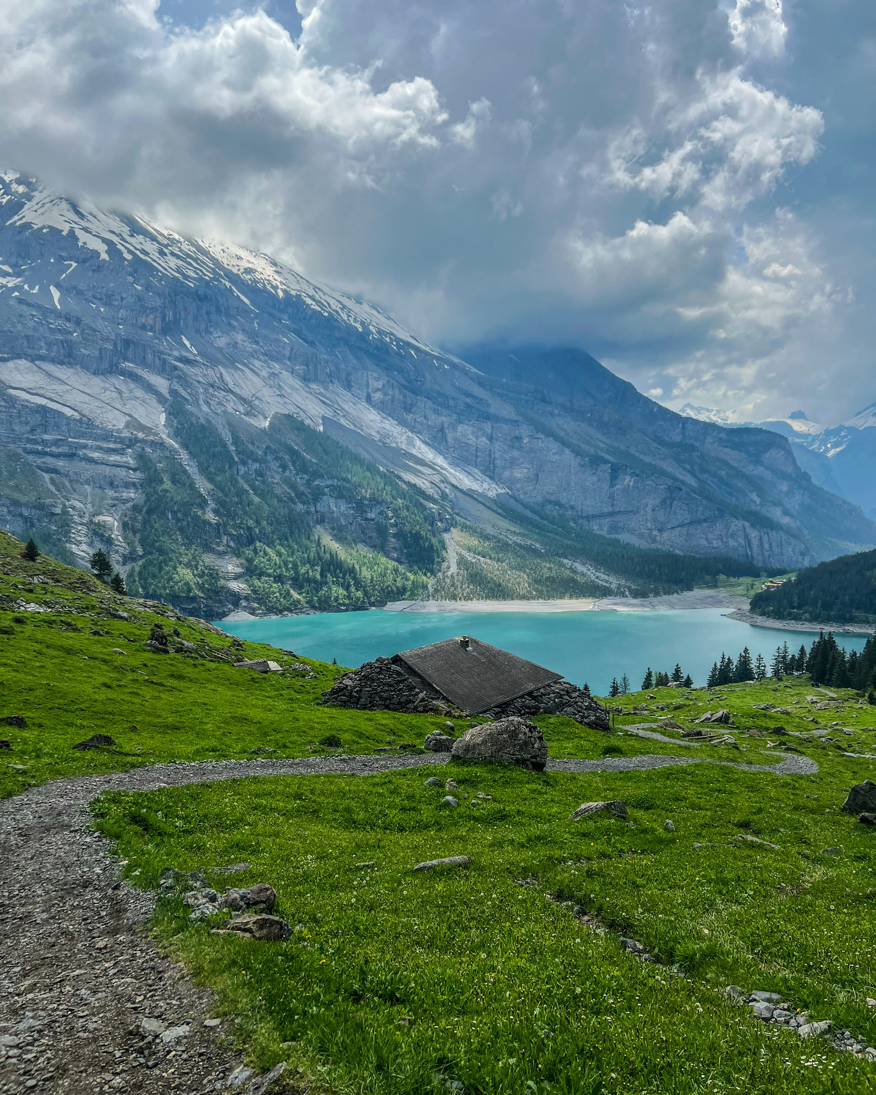 a view of a mountain lake from a trail