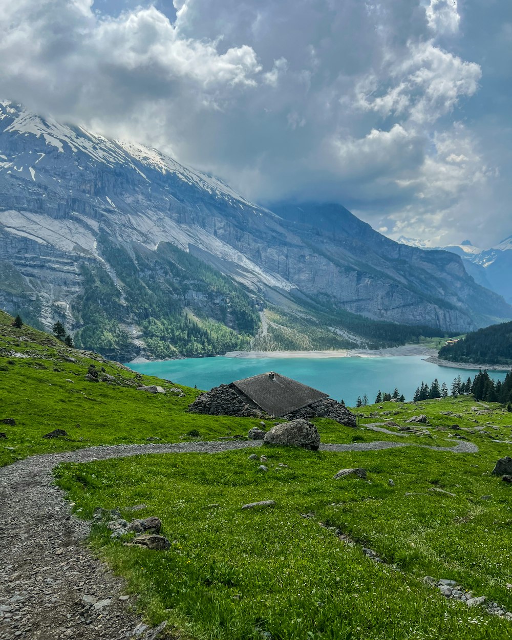 a view of a mountain lake from a trail