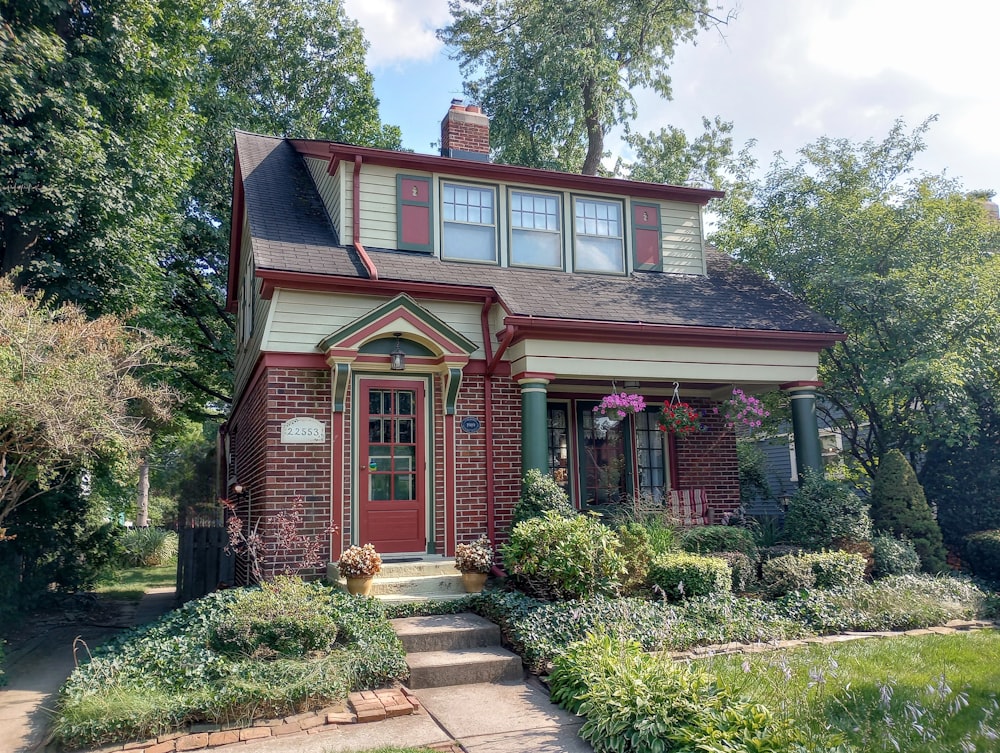 a red brick house with a red front door