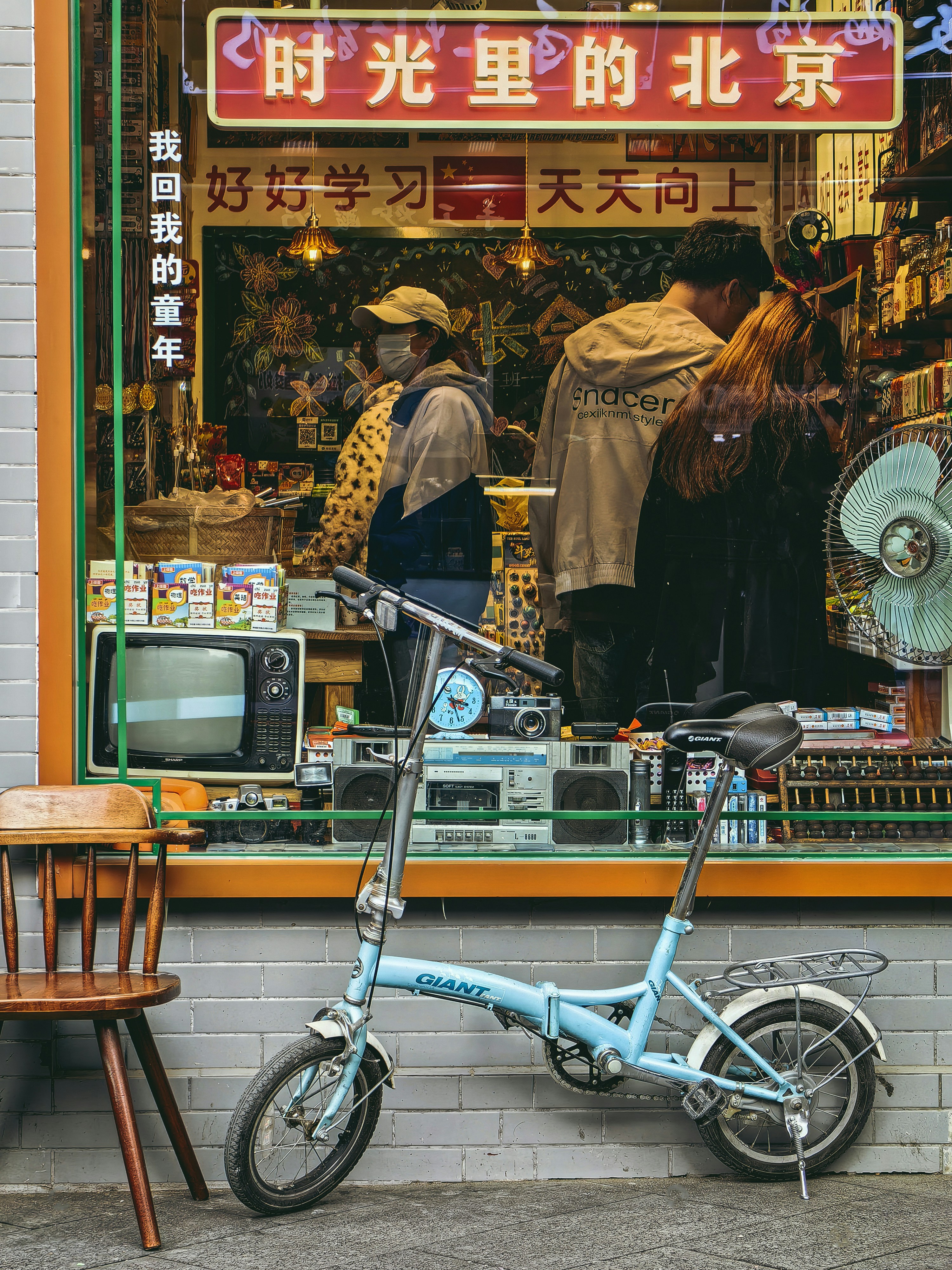 a bicycle parked in front of a store