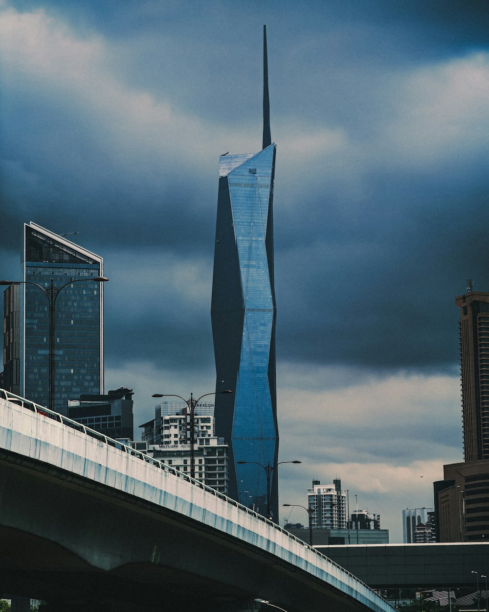 a very tall building towering over a city