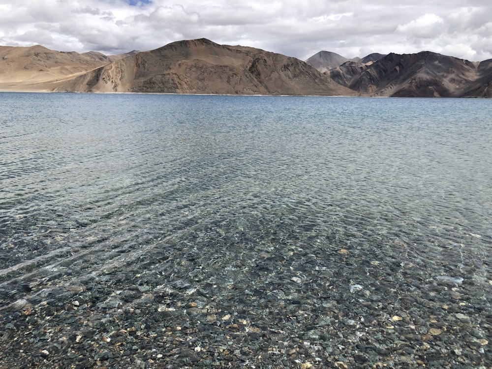 a large body of water surrounded by mountains