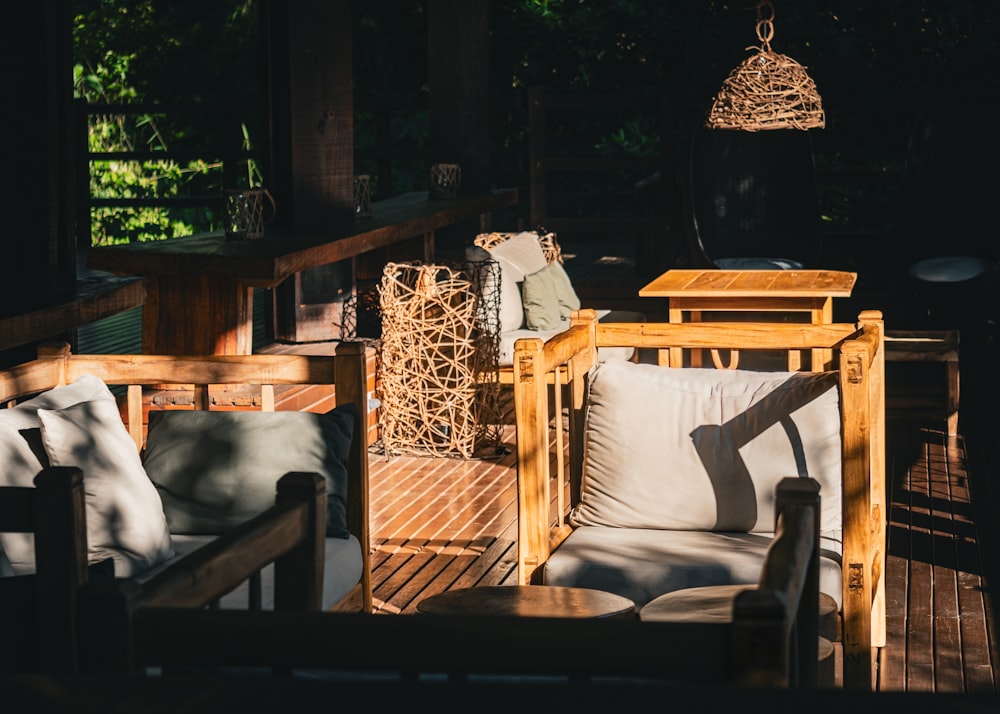 a wooden deck with chairs and a table