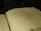 An open book with text in Tagalog, indicating it's a religious script, possibly a Bible. The page shows black printed letters on an aged, yellowish surface.
