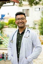 A friendly doctor smiling with a stethoscope in a bright clinic.