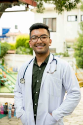 Friendly medical staff setting up mobile lab equipment outside an office building.