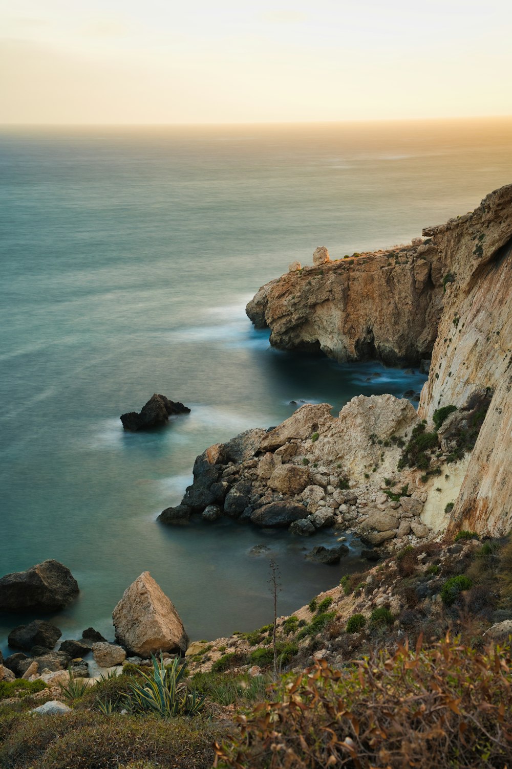 a view of the ocean from a cliff