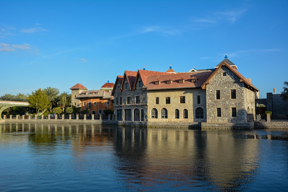 a large building sitting next to a body of water