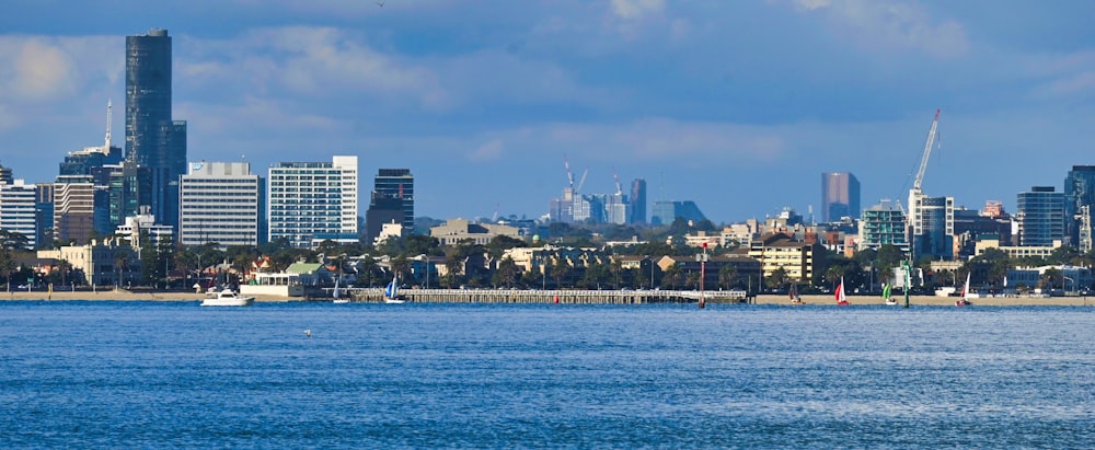 a large body of water with a city in the background