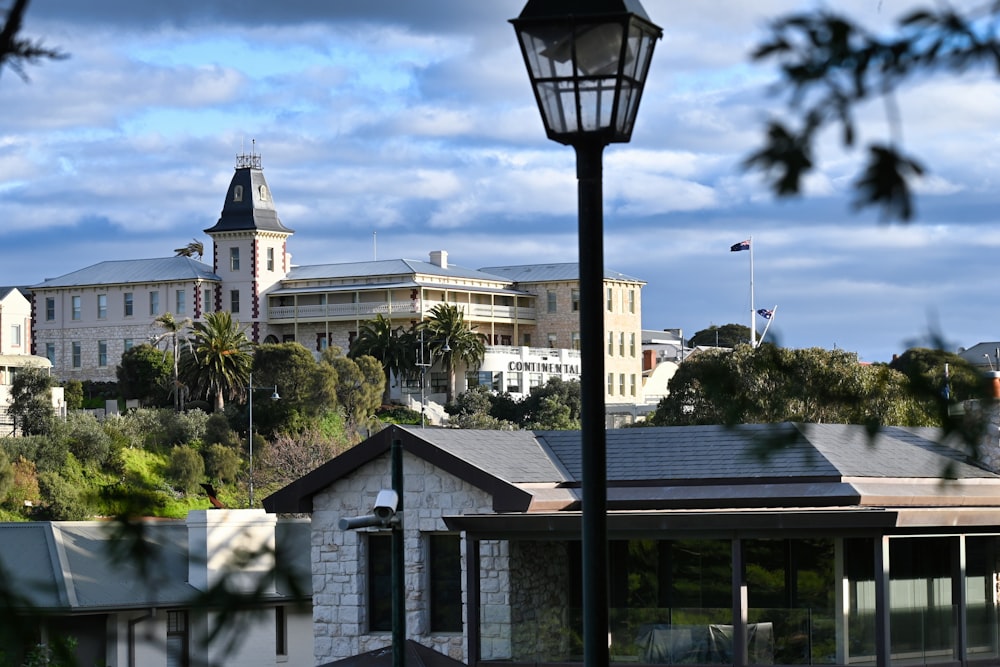 a street light in front of a large building