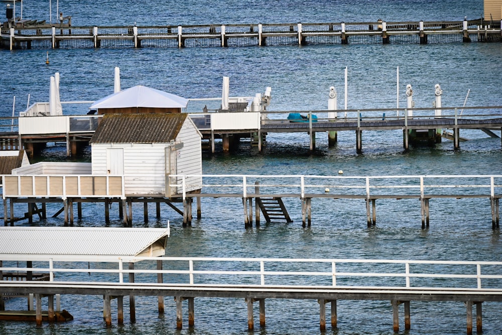 a group of houses sitting on top of a body of water