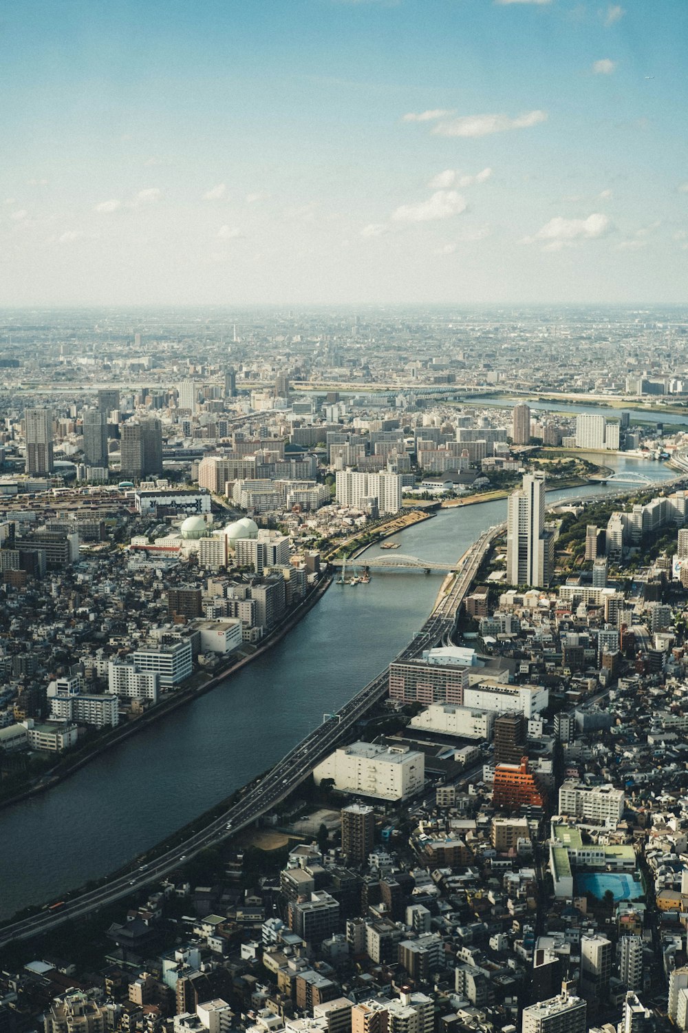 an aerial view of a city and a river