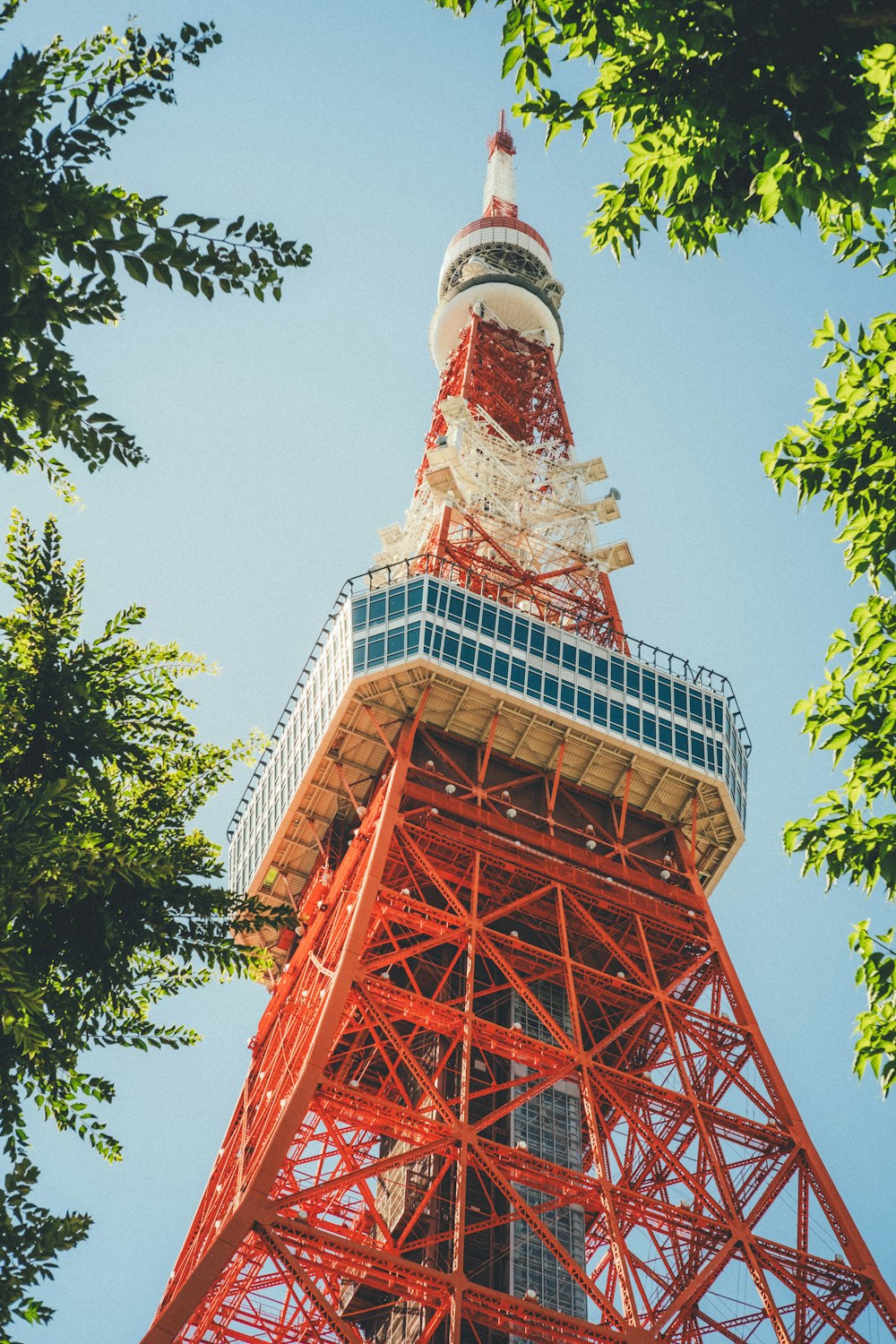 a tall red tower with a sky background