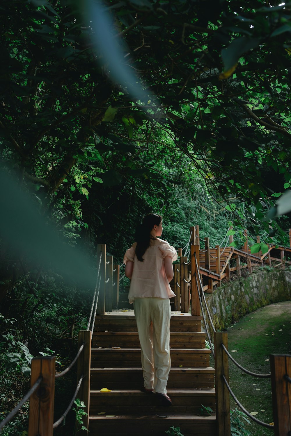 a woman walking up a flight of stairs