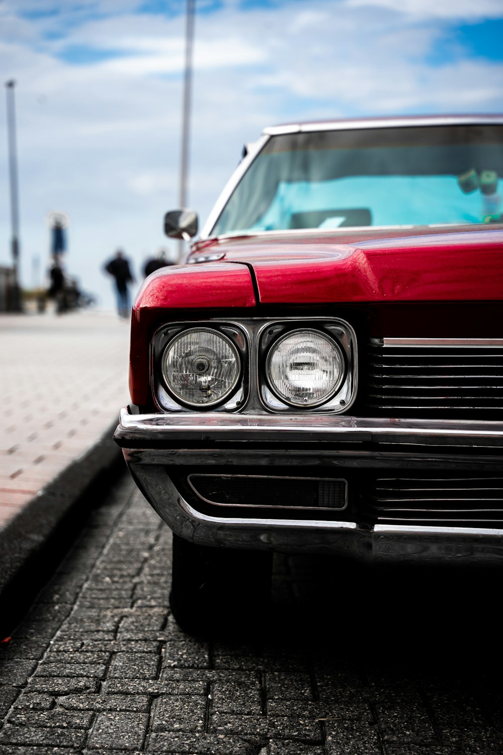 a red car parked on the side of the road