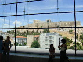 Modern room with large windows and views of the archaeological site.