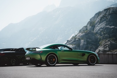 A vibrant sports car parked in a scenic location.