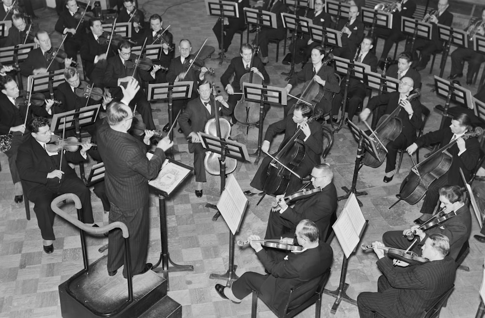 a group of men playing musical instruments in a room