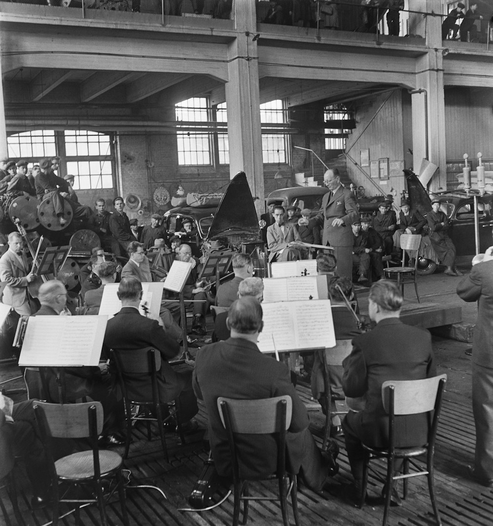 an old photo of a band playing in a building