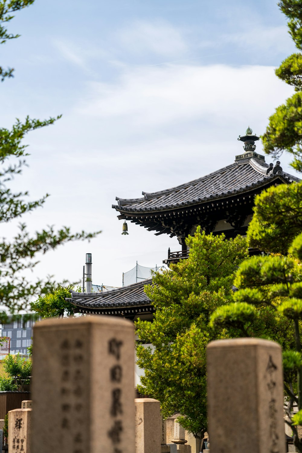 a pagoda in the middle of a cemetery