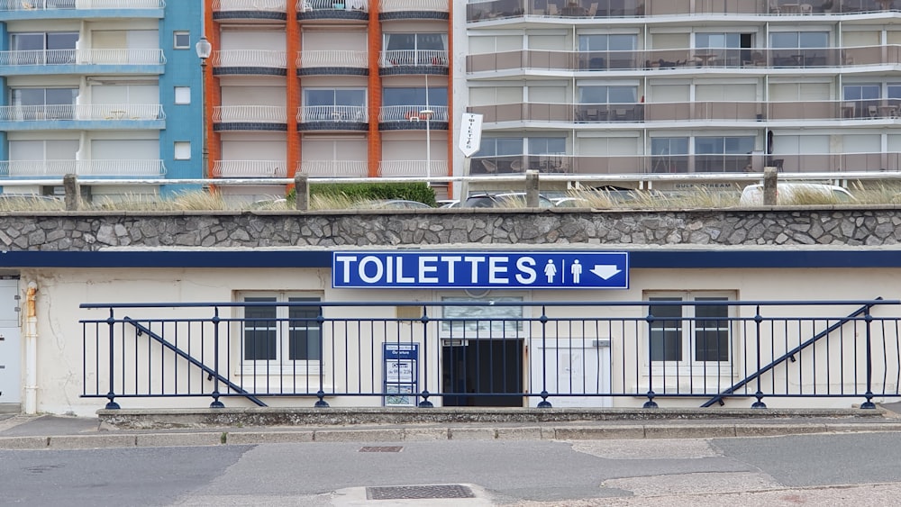 a blue and white sign on a building