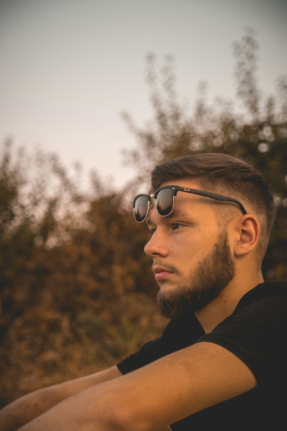 a man with a goatee and sunglasses on