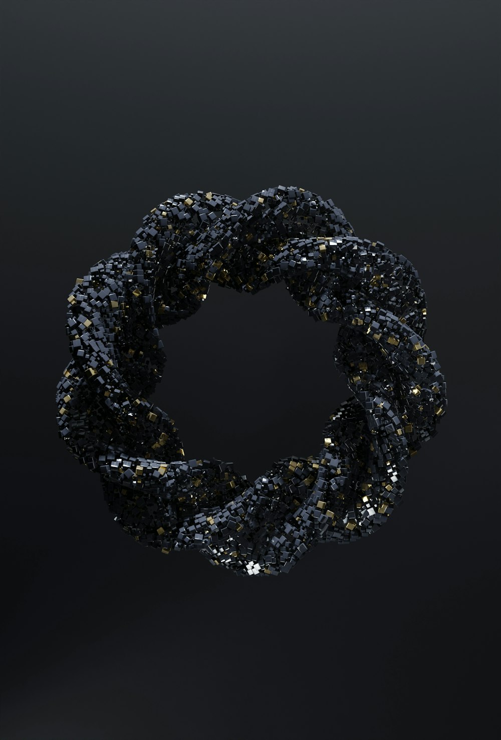 a close up of a black and gold bracelet