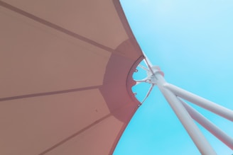 a close up of a large umbrella on a sunny day