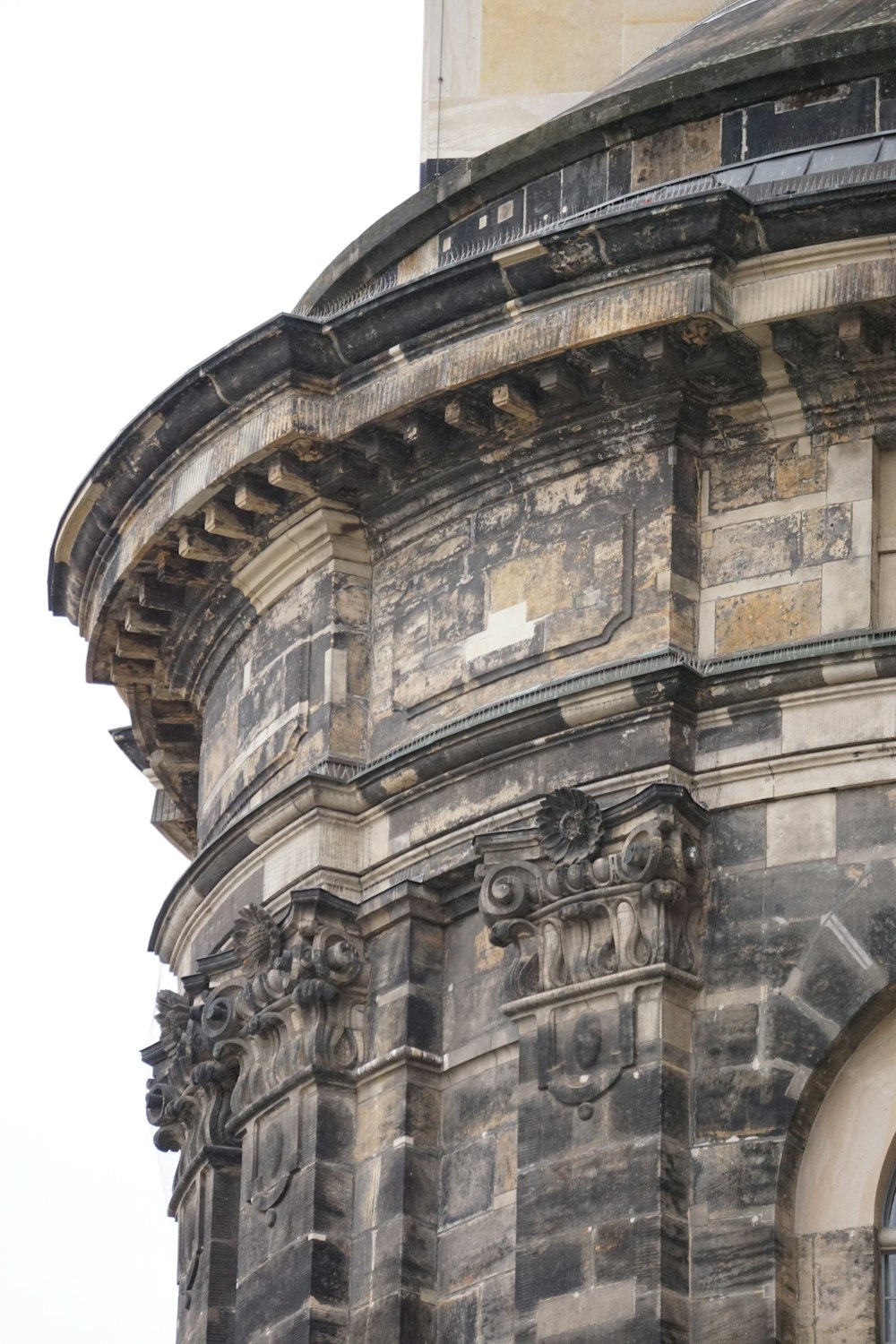 an old building with a clock on the front of it