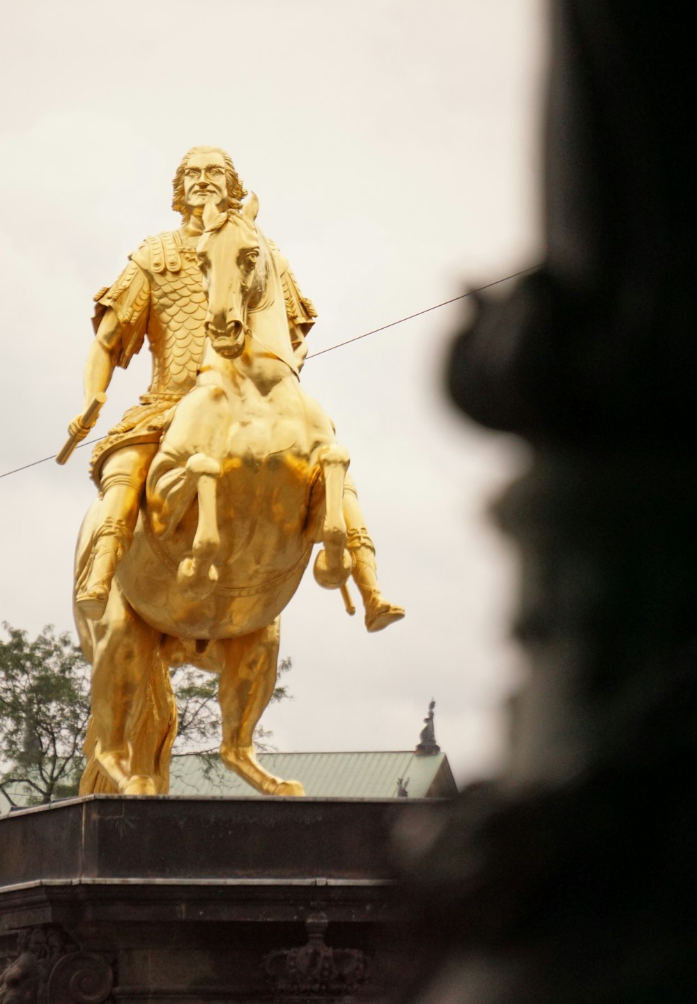 a statue of a man riding a horse