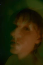 An evocative artwork blending dreamy graphics with expressive realism, featuring the avatar 'the Dreamer' in a surreal landscape.