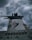 A large ship's funnel with a distinctive logo on its side, set against a backdrop of dark, ominous clouds. The funnel is white with black tops and features a red and white striped emblem with a blue curved design.