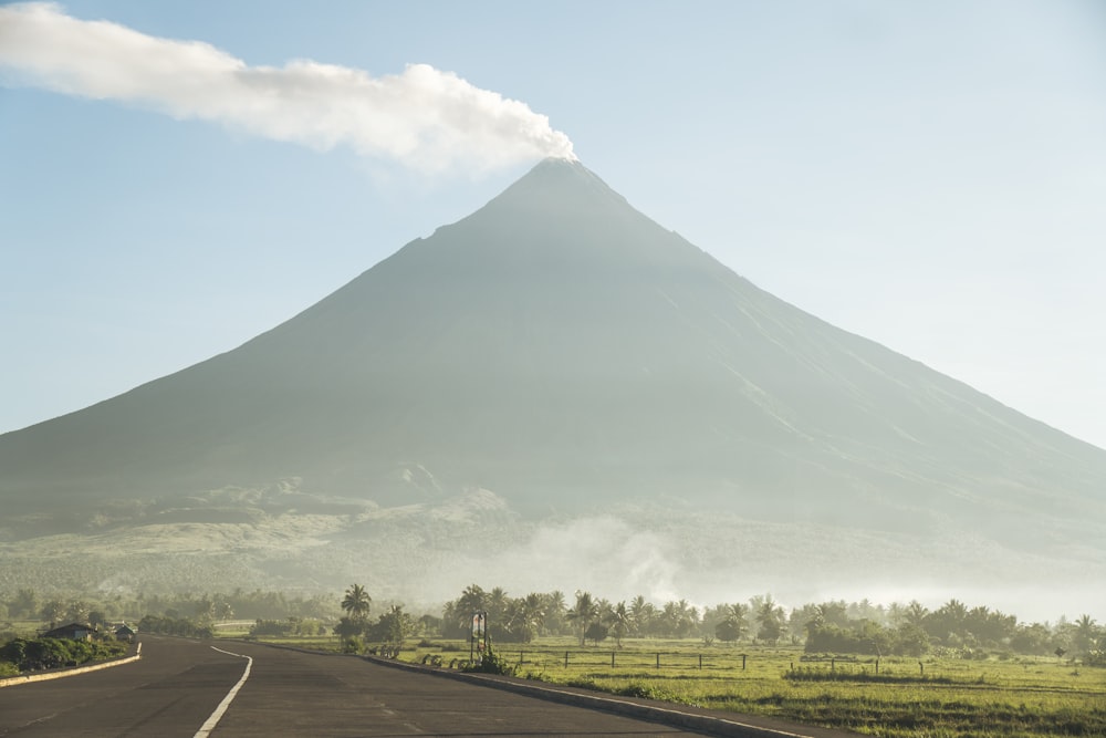 a road with a mountain in the background