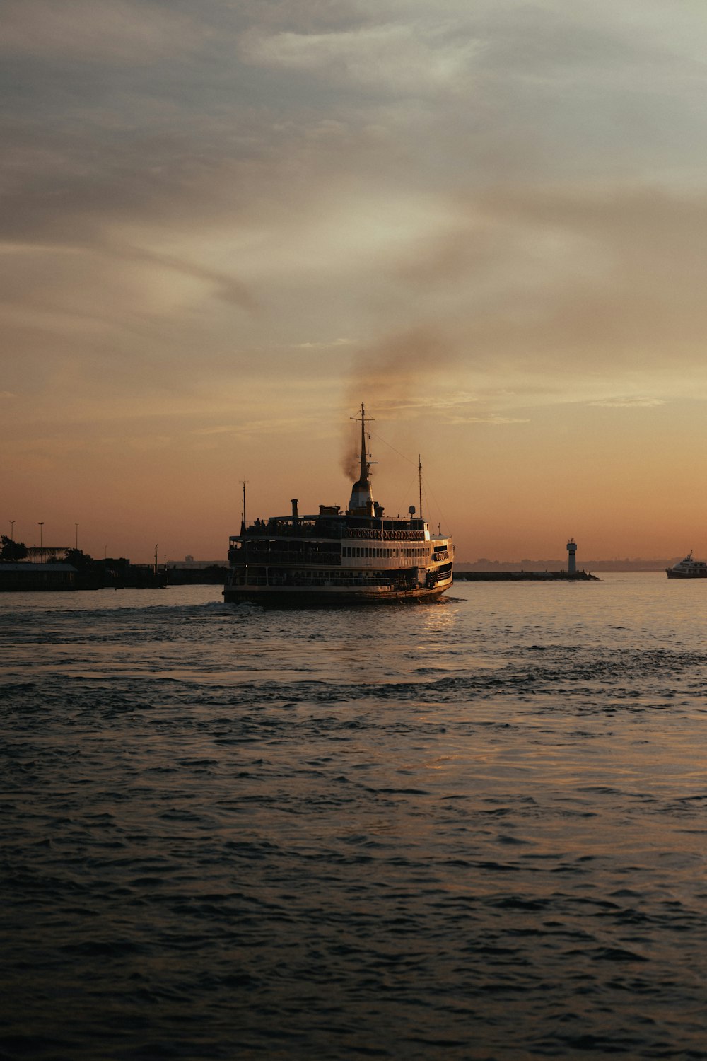 a large boat floating on top of a body of water