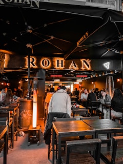 A lively cultural event in Rohan with locals sharing stories and traditional music outdoors.