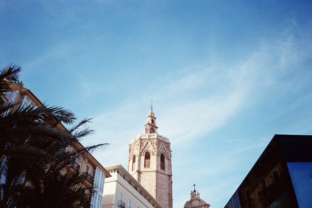 a tall tower with a clock on the top of it