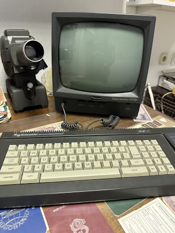 A vintage computer setup with a retro monitor and keyboard.